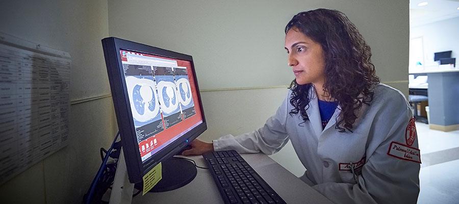 Dr. Aditi Satti looking at lung scan
