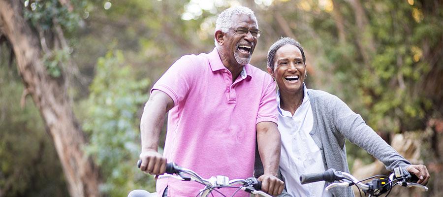 Senior African American couple riding their bikes