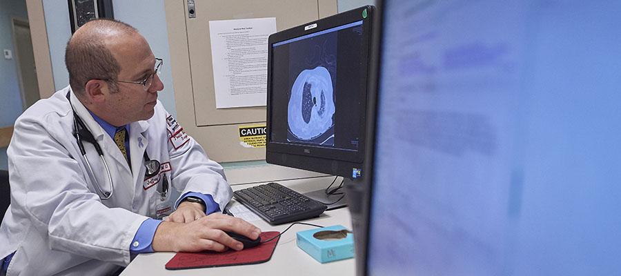 Dr. Jeffrey Stewart examining lung scan