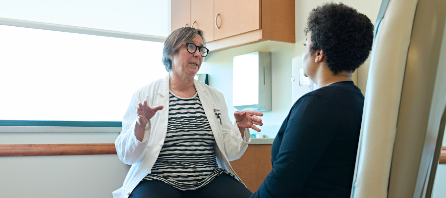 Dr. Herrine at Temple Women and Families Hospital meets with patient