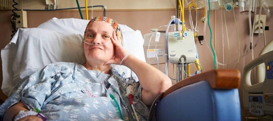 Temple patient Lisa laying in her hospital bed