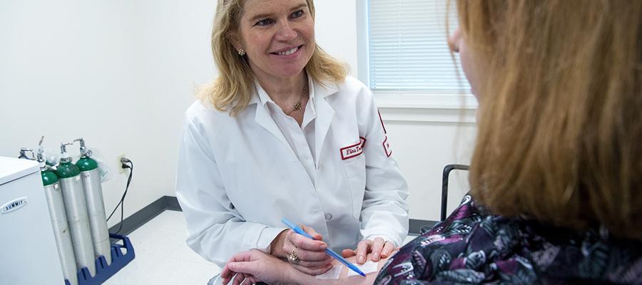 Allergy specialist testing patient