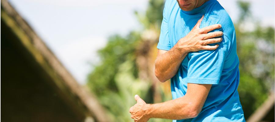 Man grasping his shoulder in pain