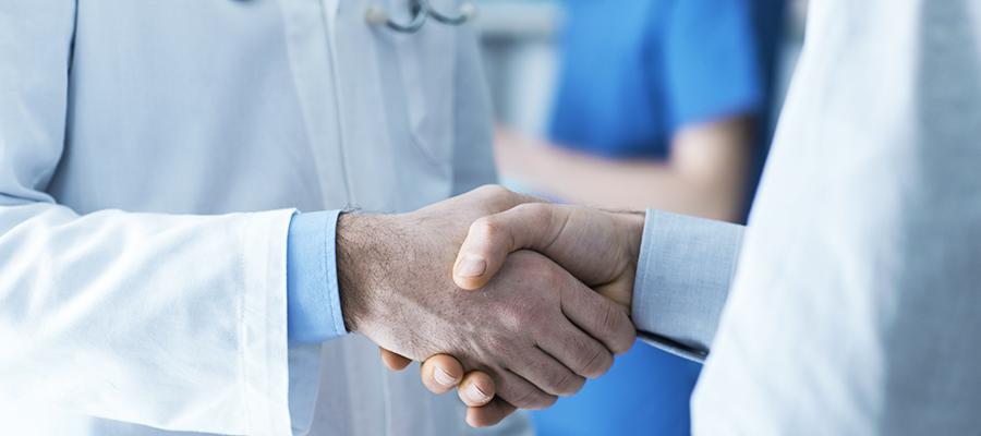 Two doctors shaking hands