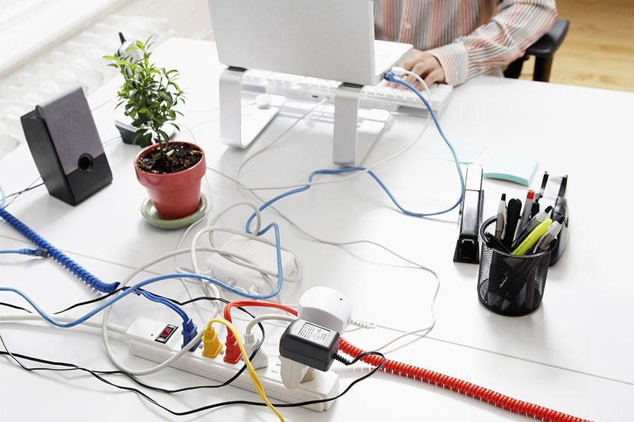 Too many electrical cords near laptop