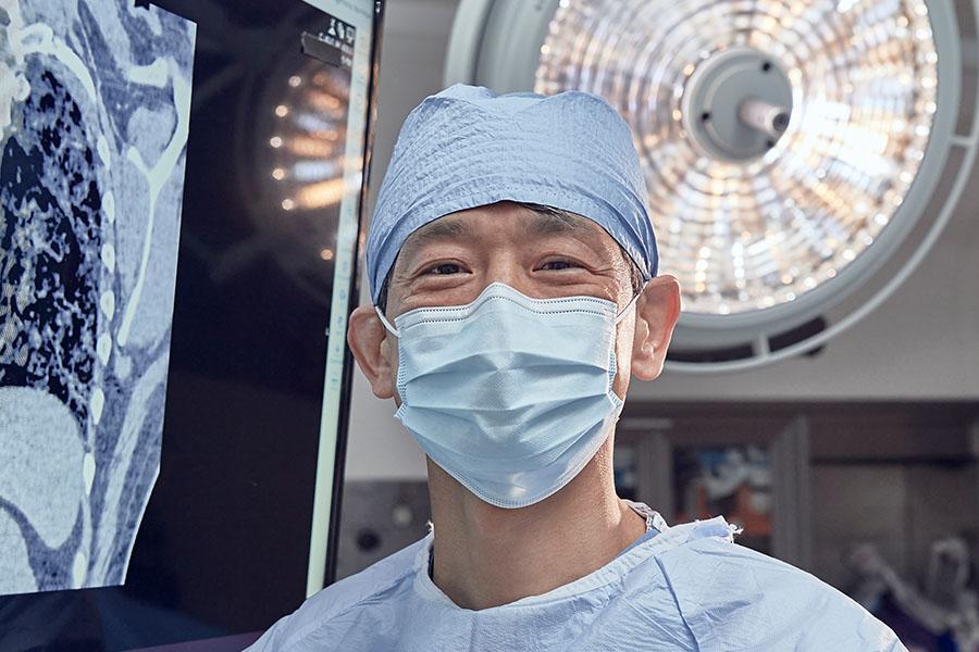 Dr. Shigemura standing in the operating room