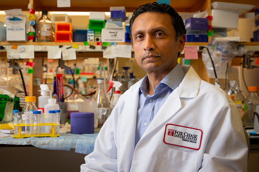 Siddharth Balachandran, PhD sitting in a laboratory