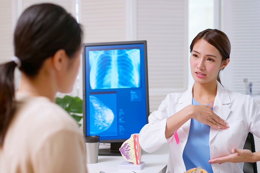 Doctor going over breast exam with patient