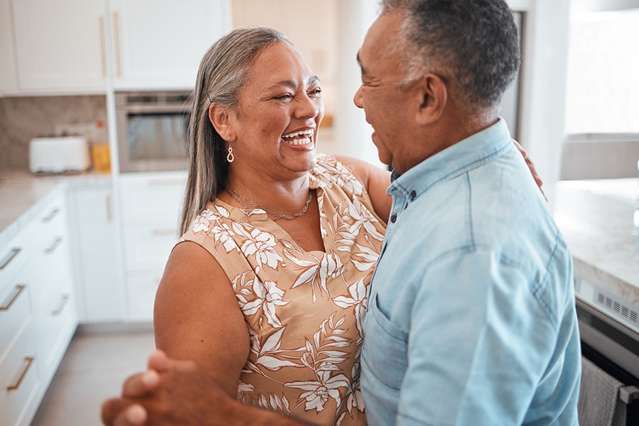 Couple dancing together in the kitchen