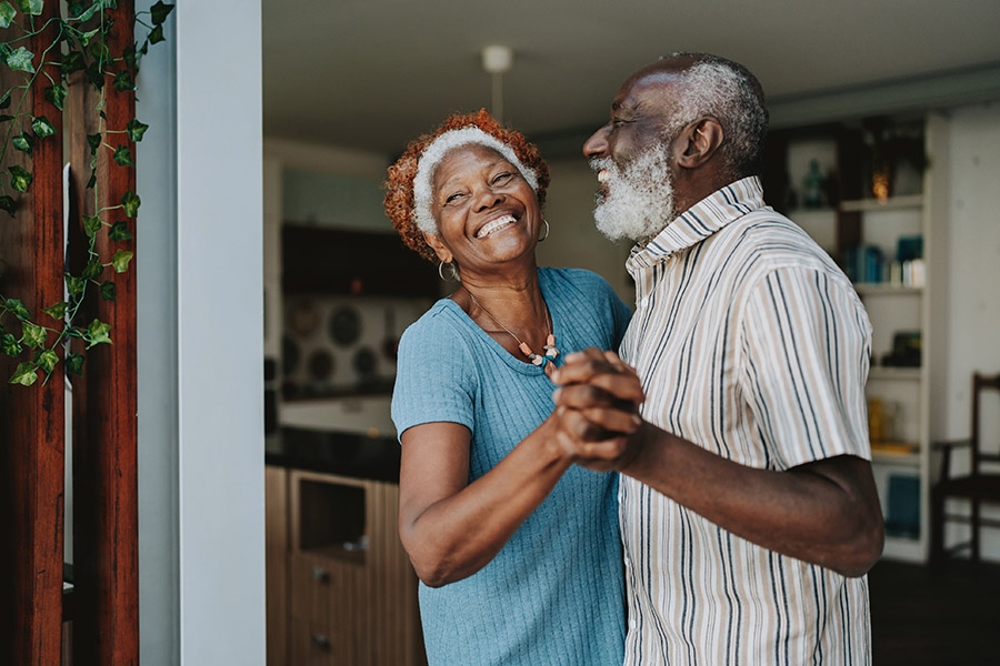 Older couple laughing and dancing