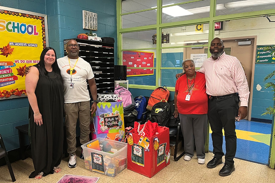 Staff members at Kenderton Elementary School with some of our donations.
