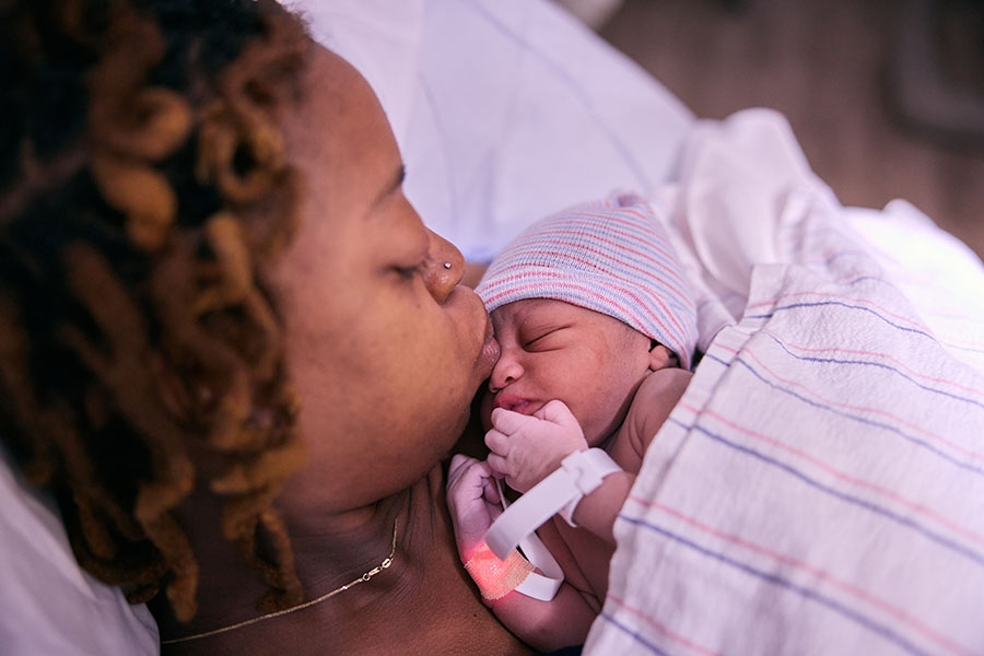 A new mom and her baby minutes after giving birth.