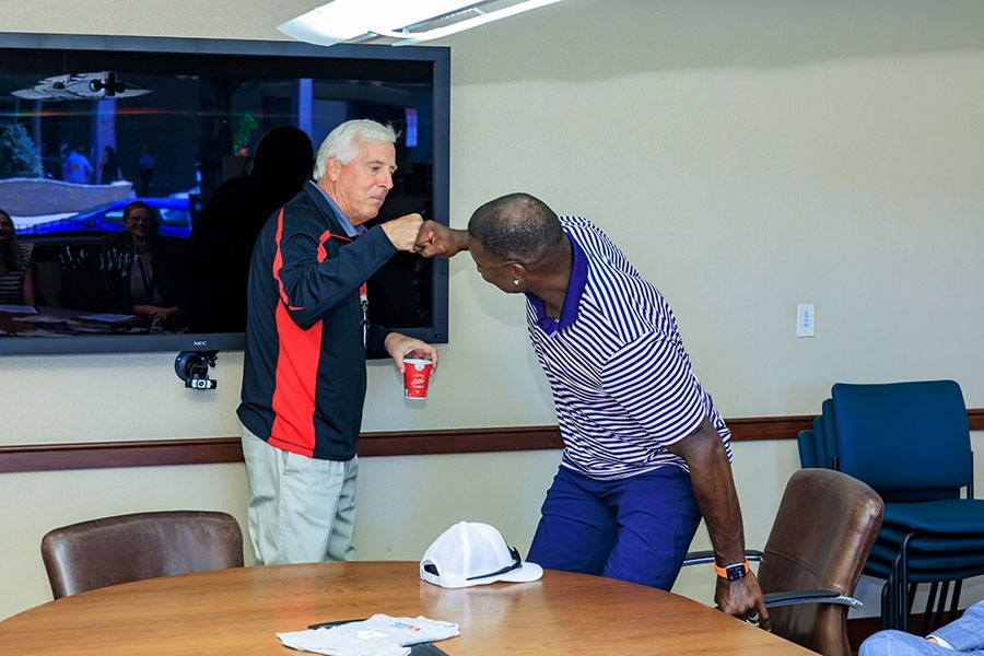 Ryan and Temple Health President & CEO Michael A. Young exchange a fist bump.