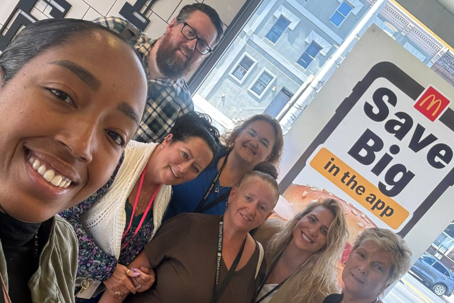 Release the Hounds (with Stinson on the far left, Hummel in the back row, center left, and Maag second from right) in McDonald's for a fast food restaurant group challenge.