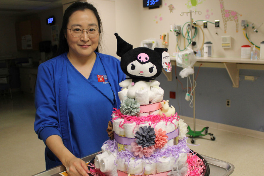 Baek with a diaper cake creation.