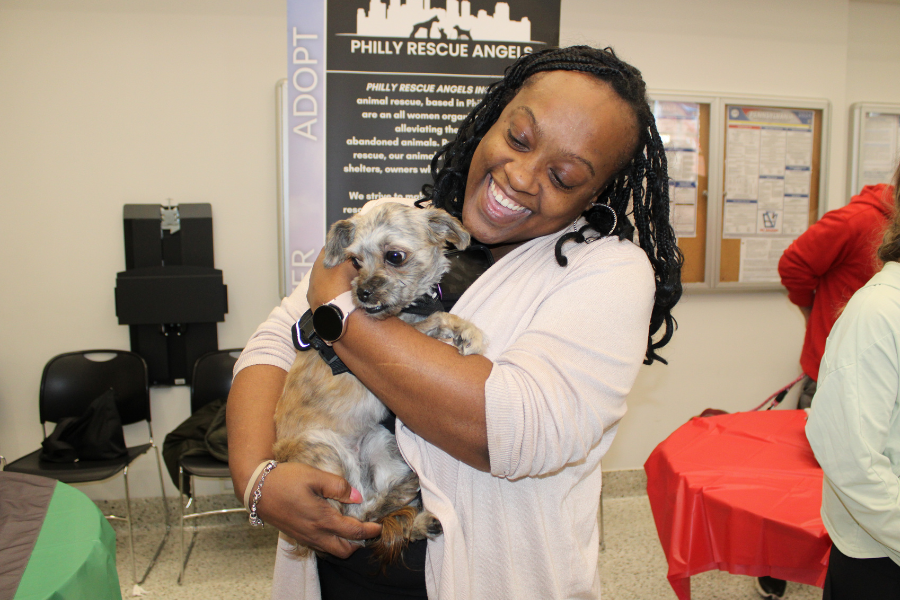 Edith, the dog pictured here, had to be coaxed out of her carrier, but once she emerged, she just wanted to be held!