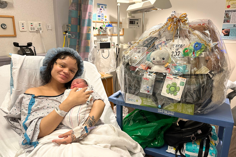 Chrystal and Adin with one of their gift baskets.
