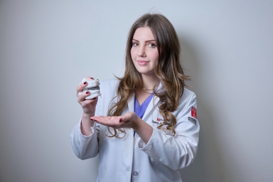 Dr. Theresa Pazionis with a personalized spinal surgery device.