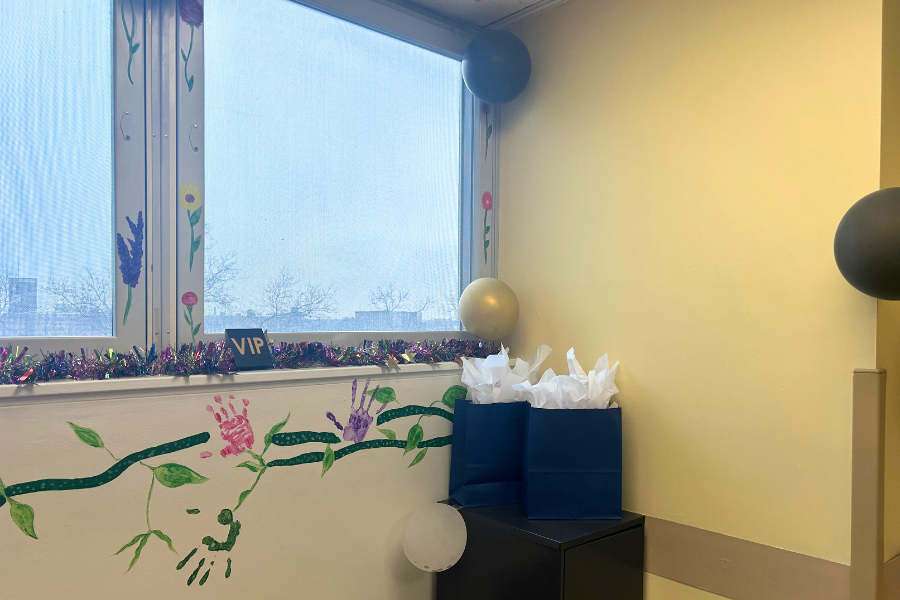 A closer look at one of the Rec Room’s hand-painted walls, with patient handprints and flowers. 