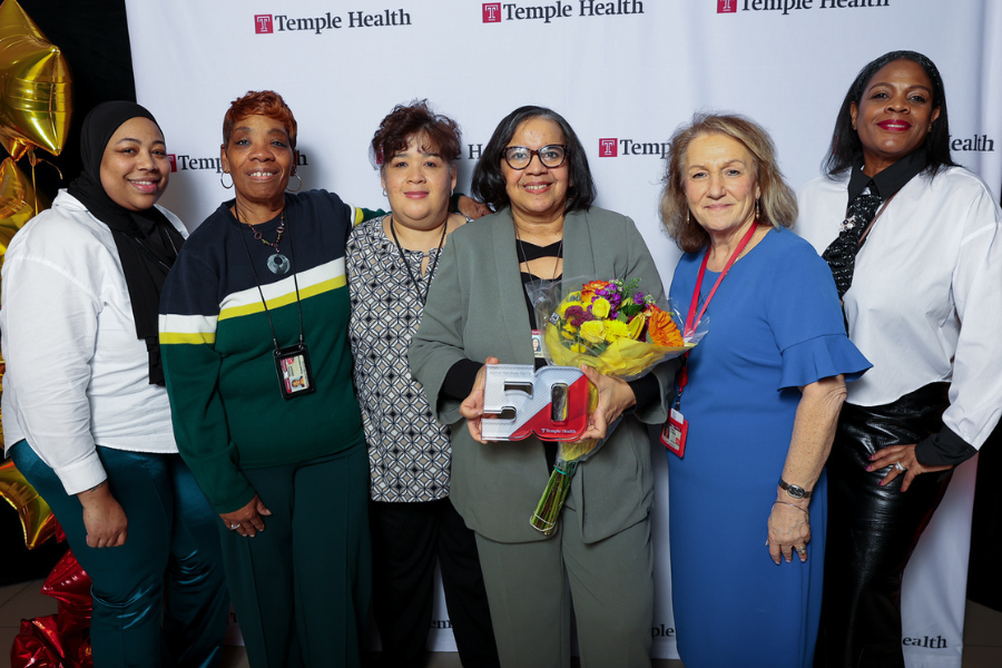 Joanne Henshaw-Harris (center)’s colleagues honor her 50 years of service at Temple Health.