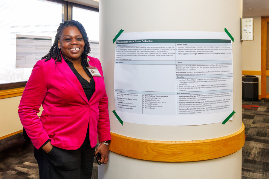 Johanna James with her poster on her project, "Biosample Repository Facility Rectal Tissue Collection Improvement.