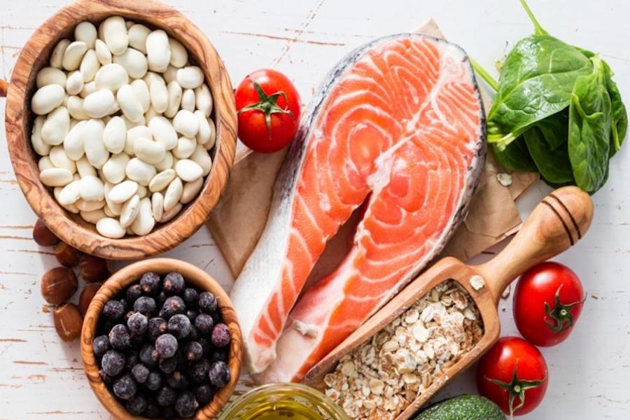 Heart healthy foods placed in the shaped of a heart