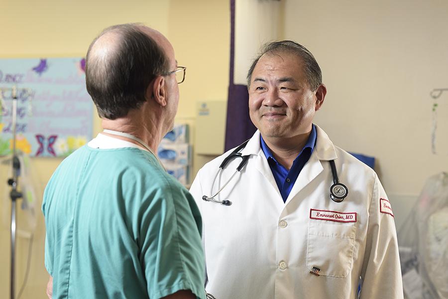 Oncologist talking with nurse