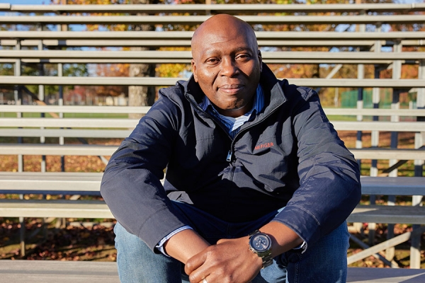 Chuka sitting on the bleachers