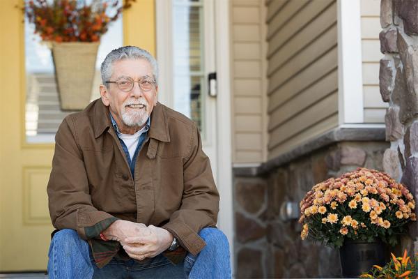 John C., sitting on his front steps
