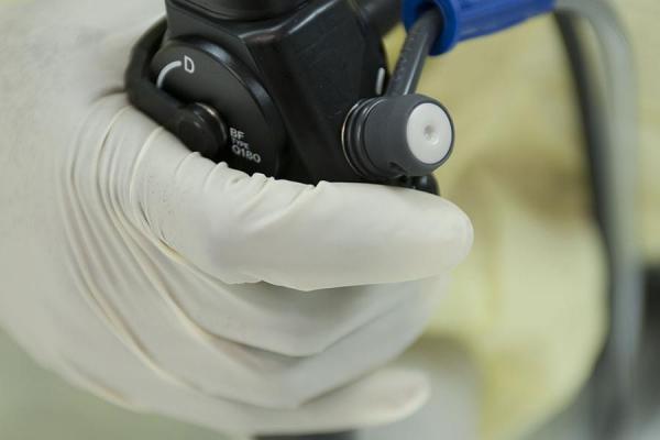 Pulmonologist holding a bronchoscope