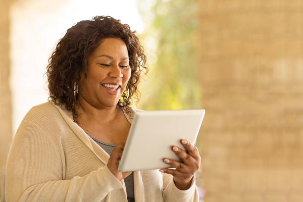 Woman viewing support groups on iPad