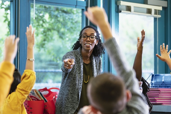 Teacher calling on students in class