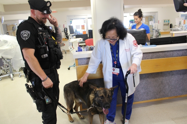 Officer Camponelli, Falko, and Ercele Reyes, BSN, MSN, Clinical Director of the SICU.