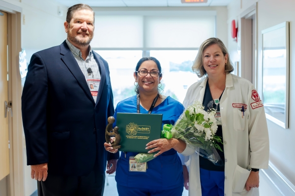 Hazlett, Thomas, and McHale celebrate Thomas' achievement