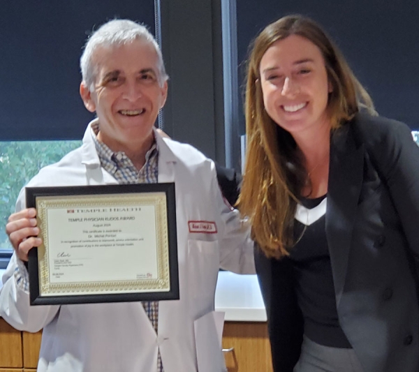 Dr. Pontari receives the TFP Physician Kudos Award from Claire Raab, MD, President & CEO of Temple Faculty Physicians.