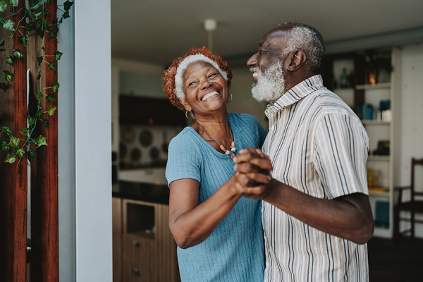 older couple dancing laughing