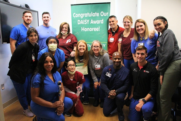 Crosley and her colleagues celebrate her achievement.