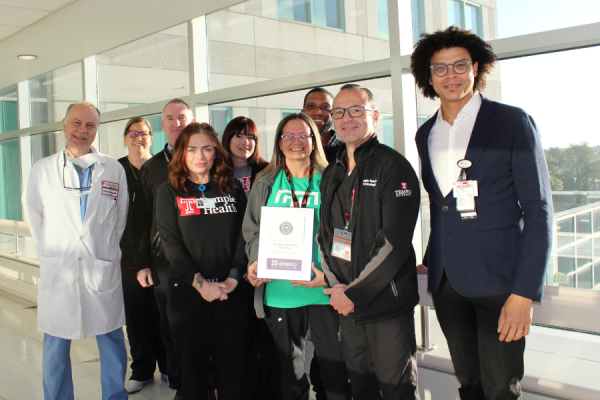 Dr. Schmieder, Kelly, and Dr. Oresanya, Associate Professor of Clinical Surgery and Associate Program Director of General Surgery Residency at the Lewis Katz School of Medicine, with the IAC Silver Award plaque.