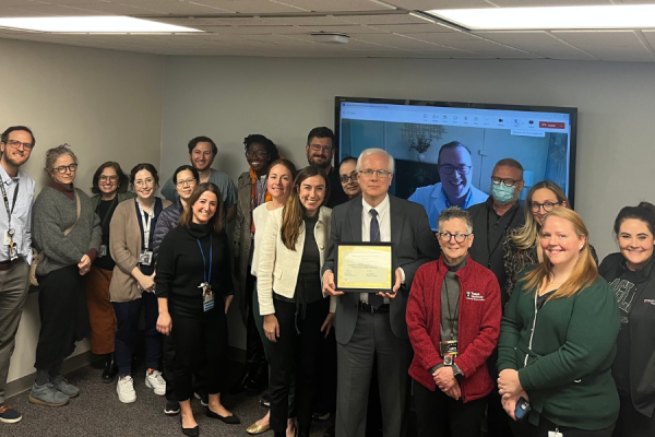 Dr. Combs (center) celebrates his TFP Physician Kudos Award with his colleague, including Claire Raab, MD (center left), President and CEO of Temple Faculty Physicians, and Amy J. Goldberg, MD, FACS (center right), The Marjorie Joy Katz Dean of the Lewis Katz School of Medicine at Temple University.  