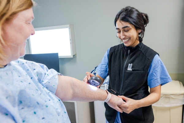 A Temple Health physician provides a free skin cancer screening at our recent event at TUH-Main Campus, hosted by Fox Chase Cancer Center at Temple University Hospital and Temple Dermatology.