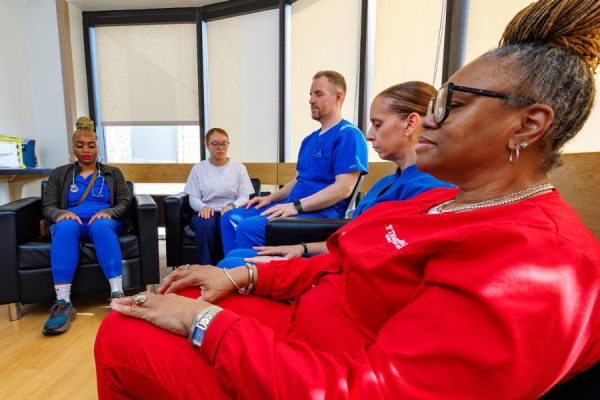 A Temple Health team member relaxes during Everett’s mindfulness workshop.