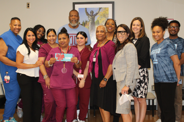 Sharon’s teammates gather to celebrate her TFP C.A.R.E.S. Award.