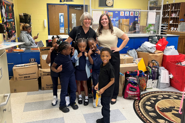 Mary McLeod Bethune School students and teachers with some of their new school supplies.