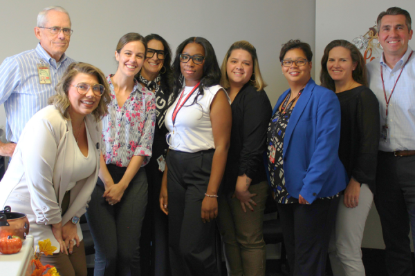Chanese’s colleagues gather to recognize her achievements.
