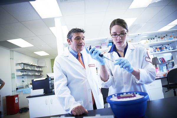 Cardiovascular researcher with graduate student