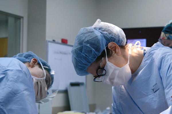 Dr. Lisa Rae performing a burn surgery