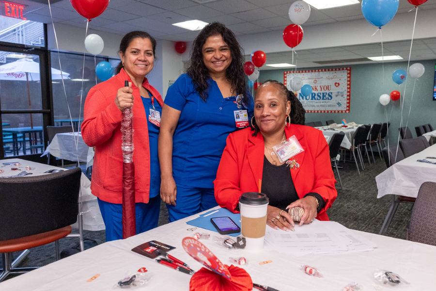 Three women posing together at Temple Health Nurse and Hospital Week