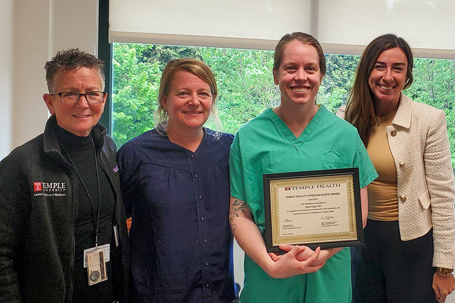 Dr. Clyatt (center right) receives the Physician Kudos award from Dr. Jeronis (center left), Claire Raab, CEO & President of Temple Faculty Physicians and Dr. Amy J. Goldberg, The Majorie Joy Katz Dean, Lewis Katz School of Medicine.