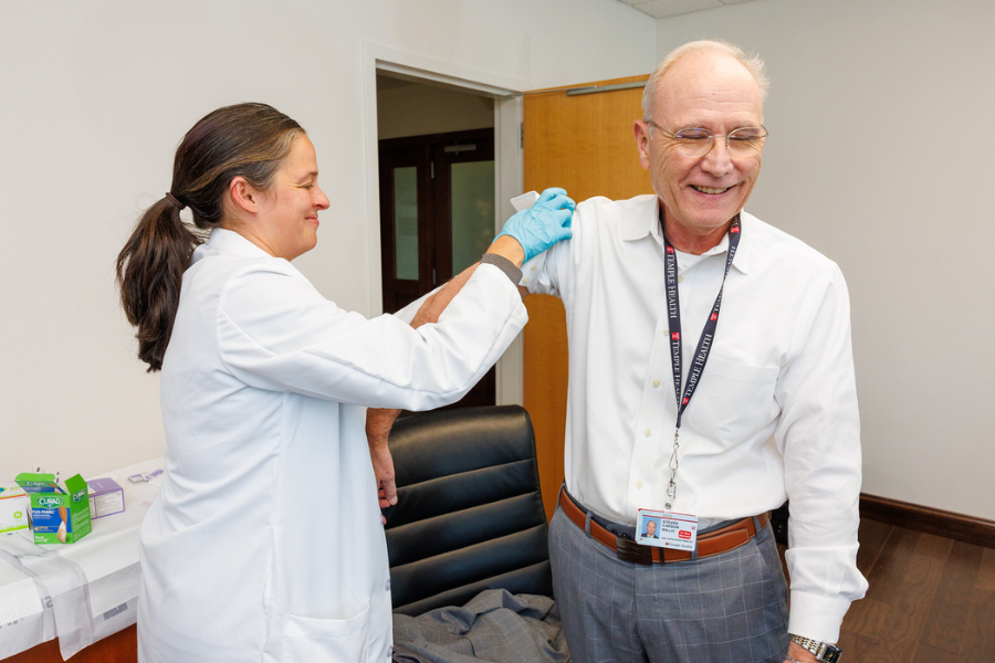 Steven R. Carson, MHA, BSN, RN, SVP of Population Health and CEO of the Temple Center for Population Health, gets his flu shot.