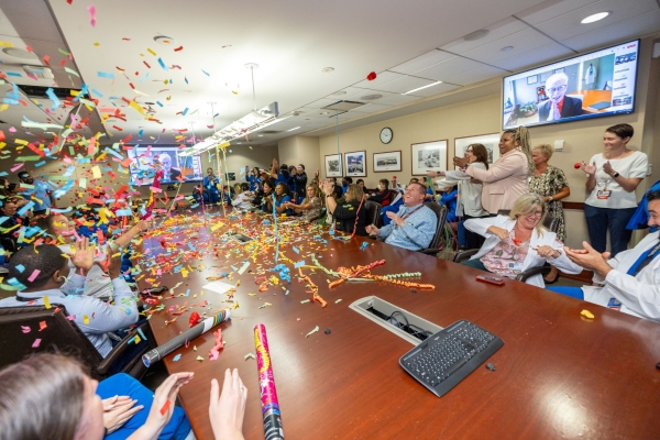 Attendees celebrate Magnet re-designation—with plenty of confetti.